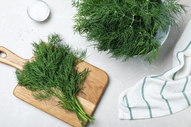 Photo of Flat lay composition with fresh dill on light table