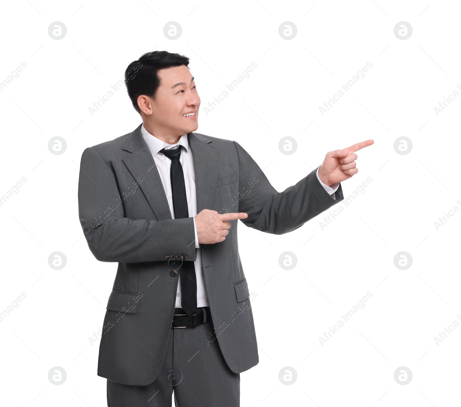 Photo of Businessman in suit pointing at something on white background