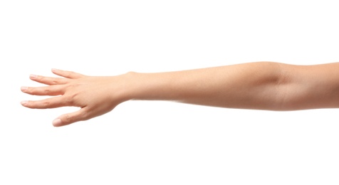 Photo of Young woman holding her hand on white background, closeup