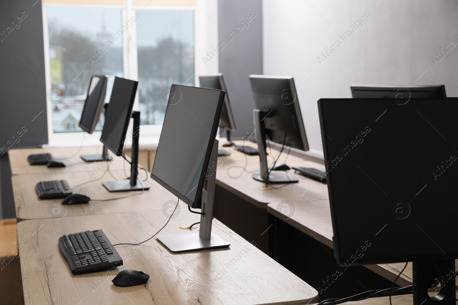 Photo of Many modern computers in open space office