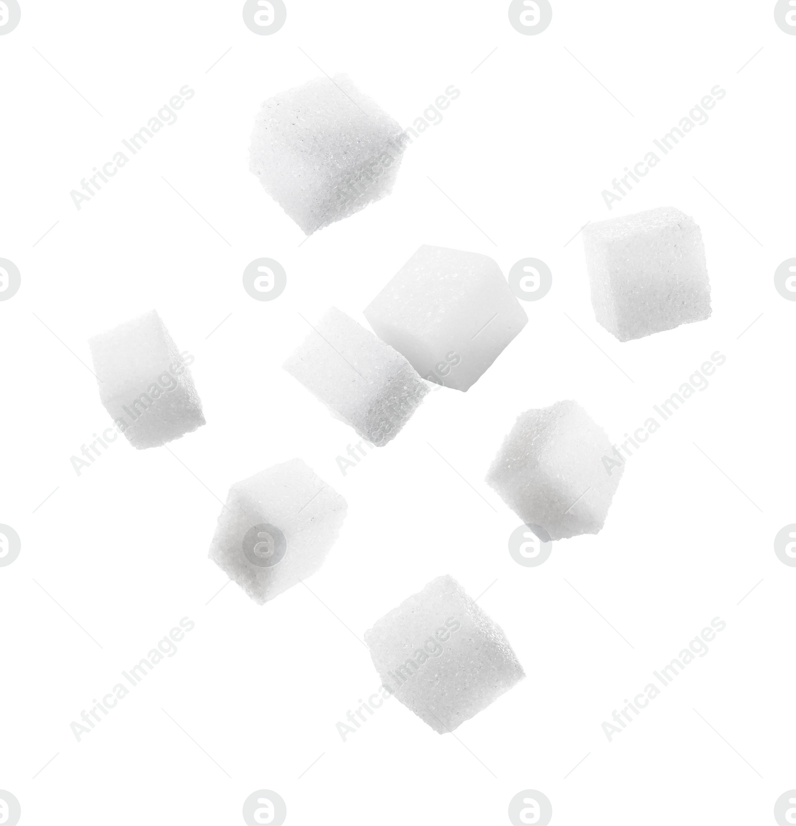 Image of Refined sugar cubes in air on white background