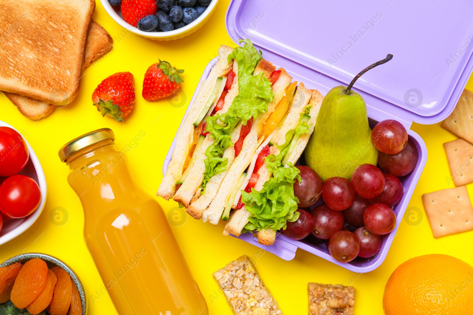 Photo of Flat lay composition with lunch box and tasty healthy food on yellow background. School dinner
