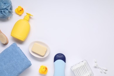 Photo of Different baby bath accessories and cosmetic products on white background, flat lay. Space for text