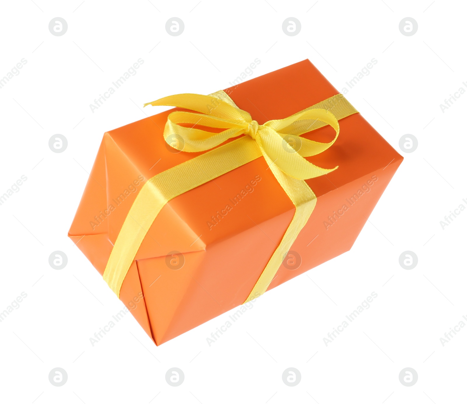 Photo of Orange gift box with yellow bow isolated on white