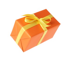 Orange gift box with yellow bow isolated on white