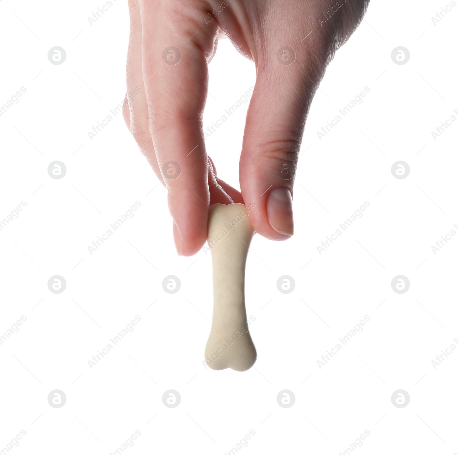 Photo of Woman holding bone shaped dog cookie on white background, closeup