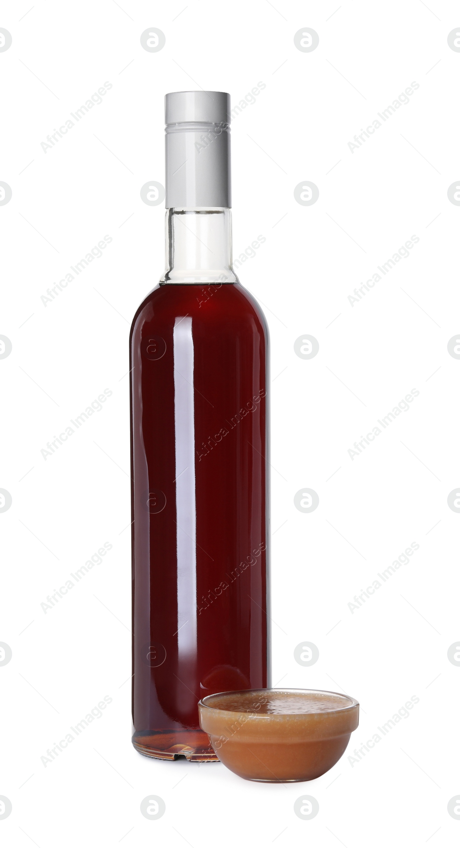 Photo of Delicious syrup and bowl of caramel sauce on white background