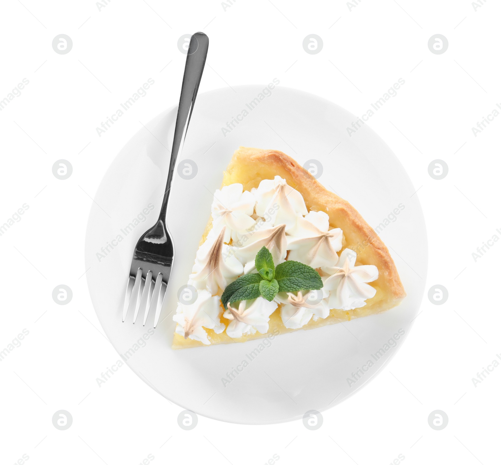 Photo of Piece of delicious lemon meringue pie with plate and fork isolated on white, top view