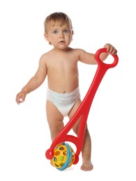 Photo of Cute baby with push toy learning to walk on white background