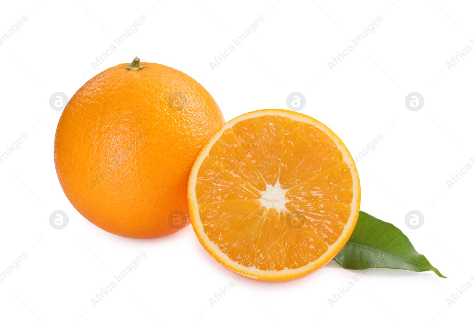 Photo of Whole and cut ripe oranges isolated on white