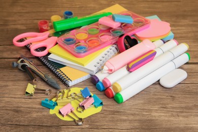 Many different school stationery on wooden table, closeup. Back to school