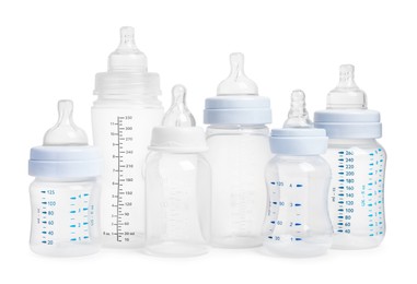 Photo of Many different empty feeding bottles for infant formula on white background