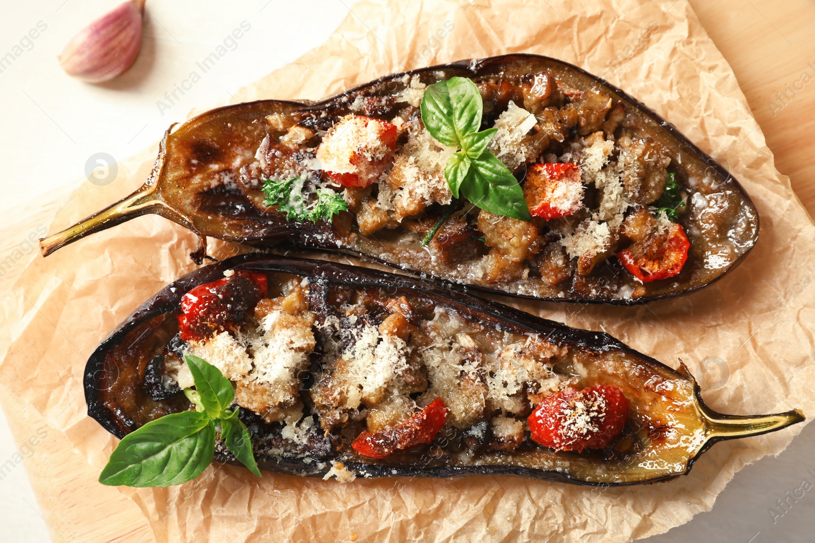 Photo of Flat lay composition with stuffed eggplants on light table