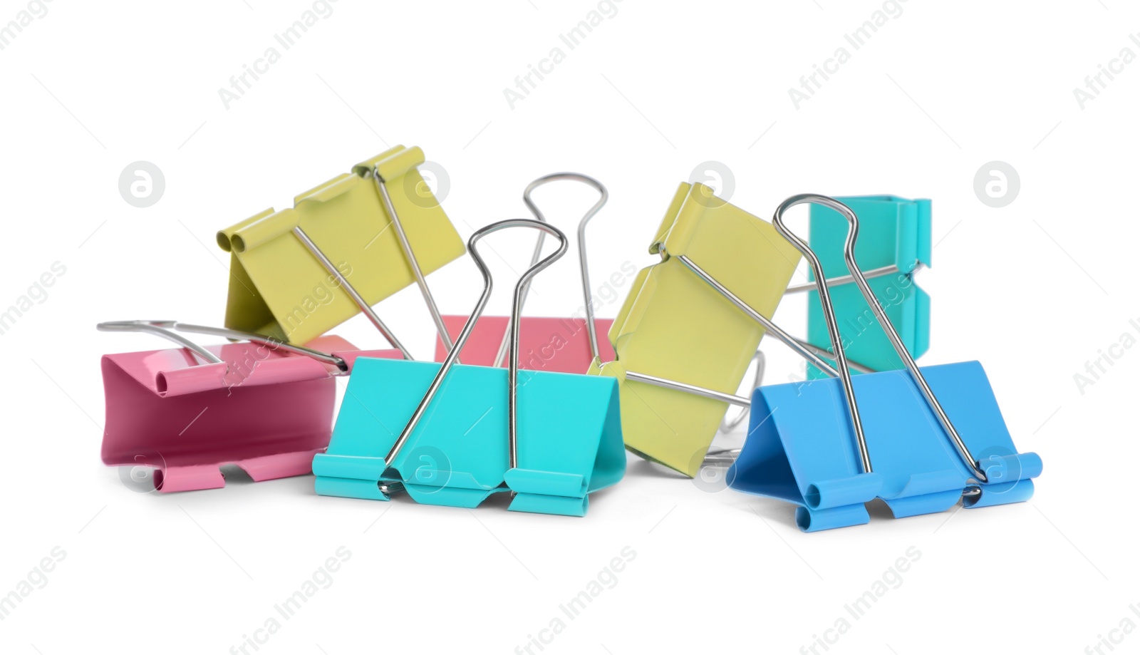 Photo of Colorful binder clips on white background. Stationery item