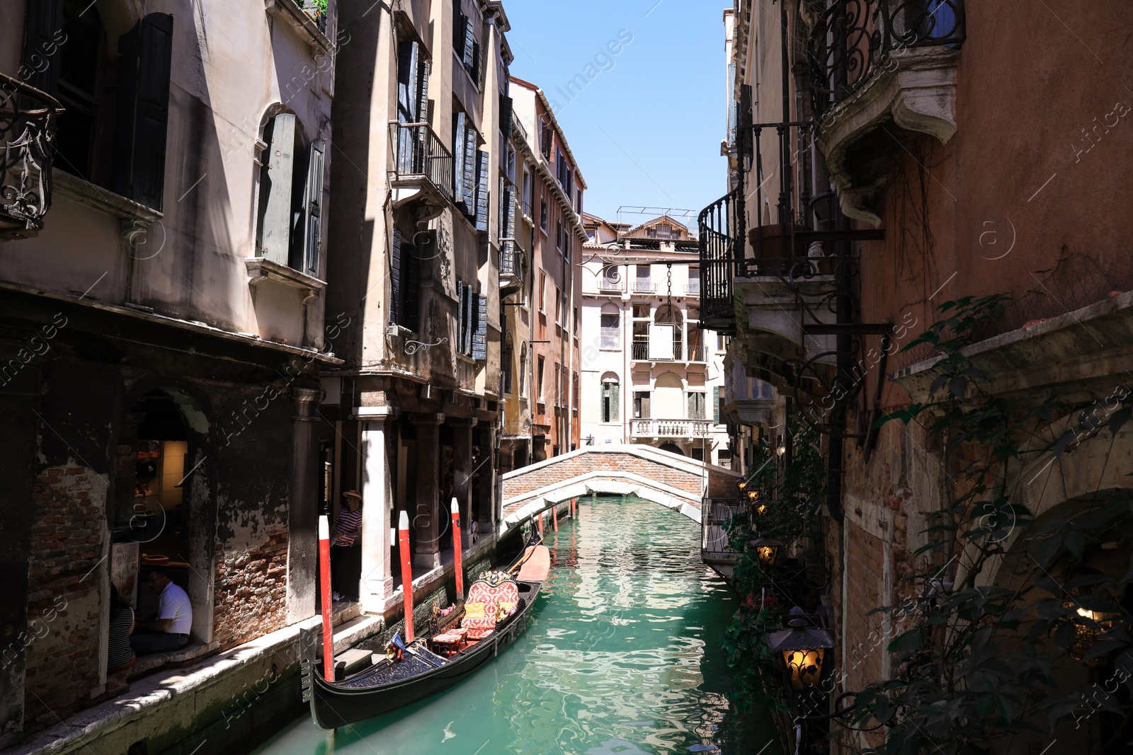 Photo of VENICE, ITALY - JUNE 13, 2019: Gondola on city canal. Gondola is traditional Venetian rowing boat