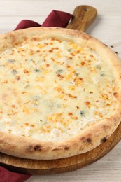 Delicious cheese pizza on white wooden table, closeup