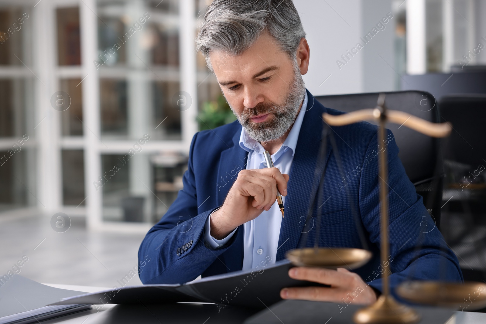 Photo of Portrait of handsome lawyer in office, space for text
