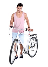 Handsome young hipster man with bicycle on white background