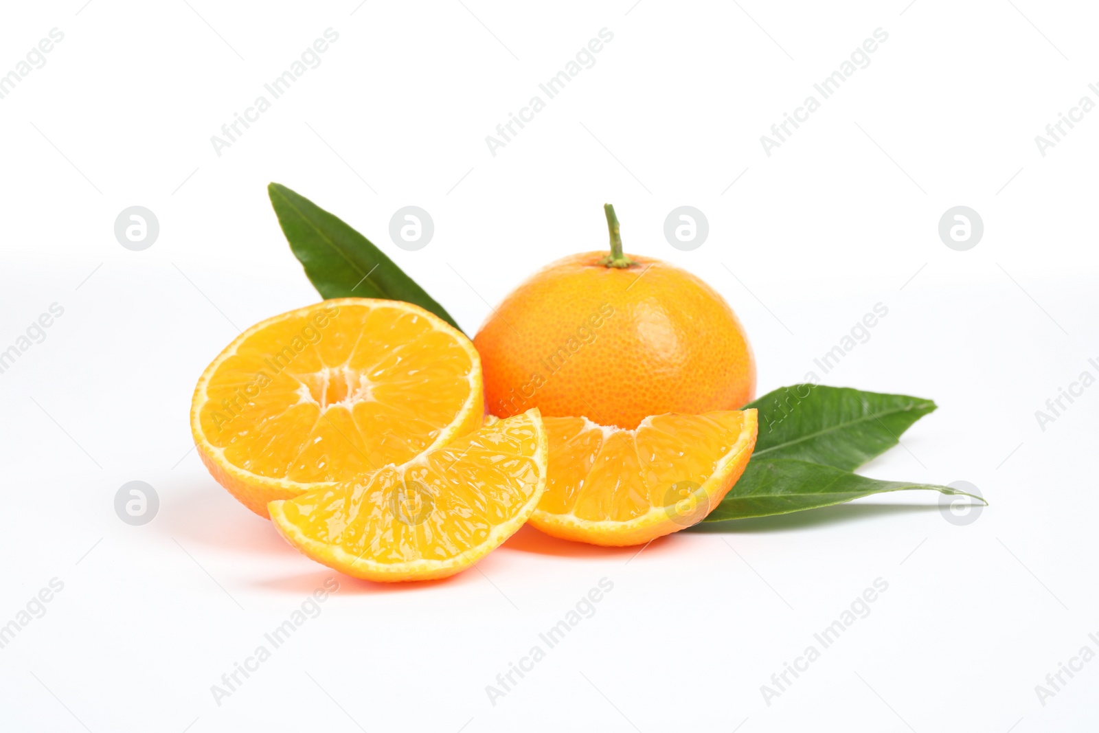 Photo of Fresh ripe tangerines with leaves isolated on white. Citrus fruit