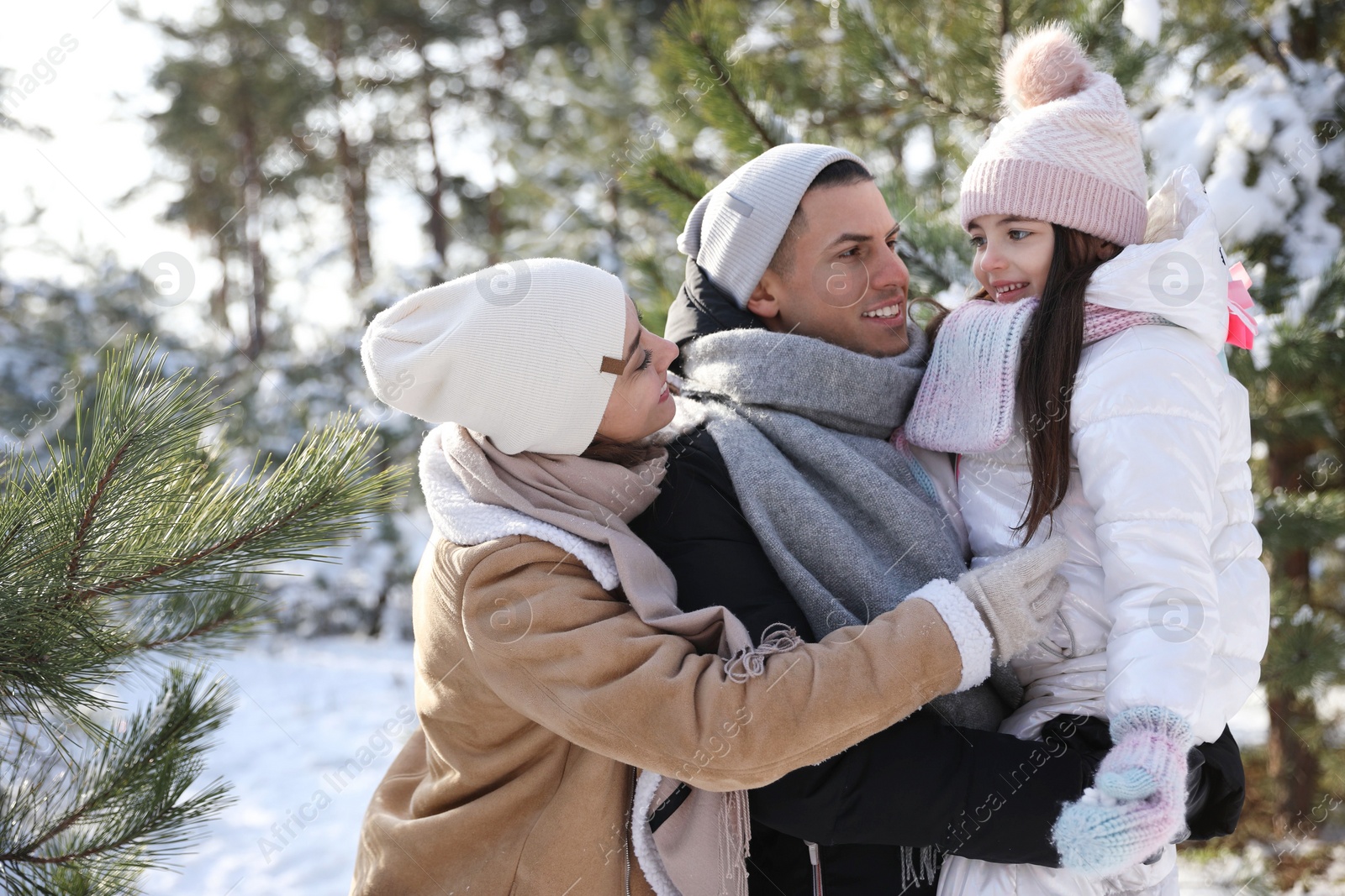 Photo of Happy family outdoors on winter day. Christmas vacation