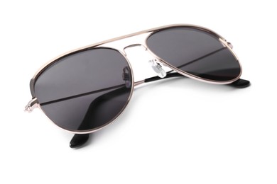 Photo of New stylish aviator sunglasses isolated on white