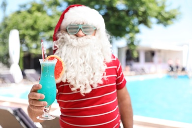 Photo of Authentic Santa Claus with cocktail at resort