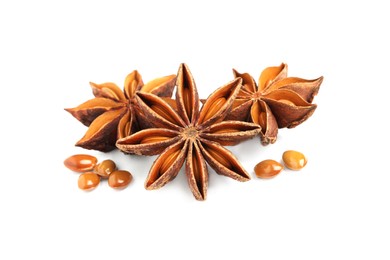 Dry anise stars with seeds on white background