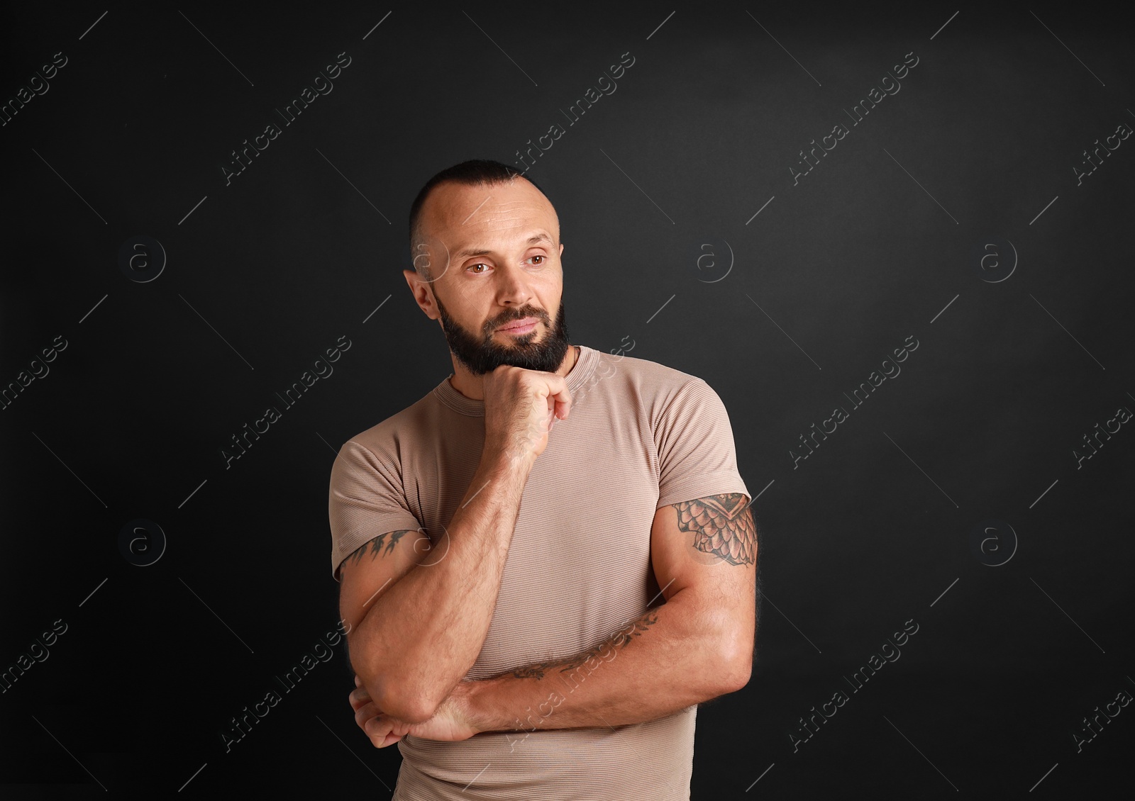 Photo of Portrait of handsome man on black background