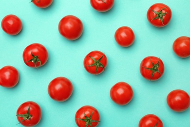 Photo of Flat lay composition with ripe tomatoes on color background