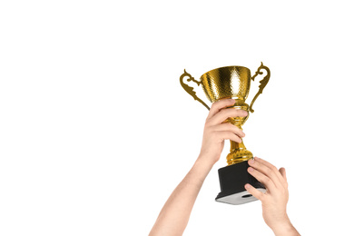 Photo of Man holding gold trophy cup on white background, closeup