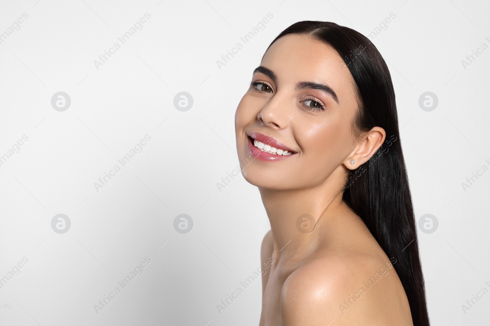 Photo of Portrait of attractive young woman on light grey background, space for text. Spa treatment