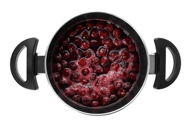 Photo of Pot with cherries in sugar syrup on white background, top view. Making delicious jam