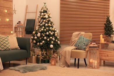 Photo of Beautiful Christmas tree and furniture in festively decorated room