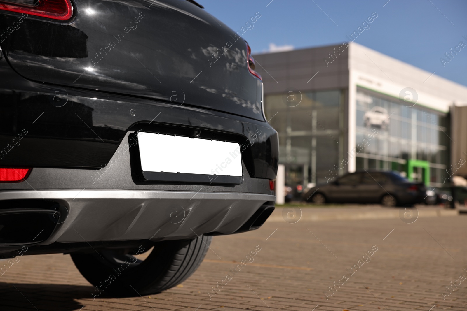 Photo of Car with vehicle registration plate outdoors, closeup