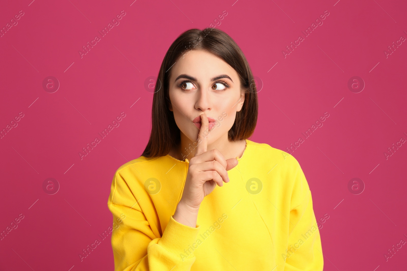 Photo of Portrait of young woman on pink background