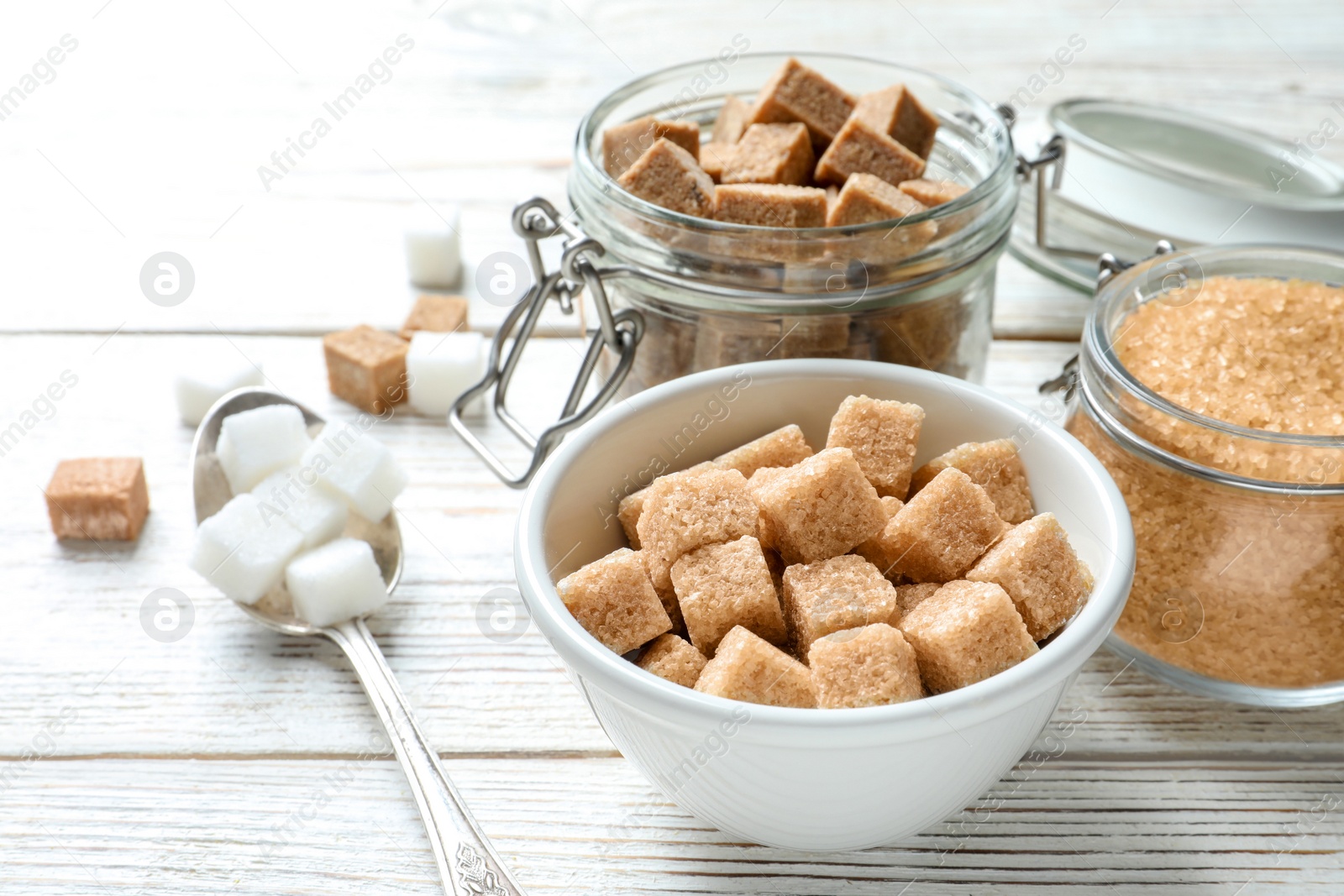 Photo of Various kinds of sugar on wooden background