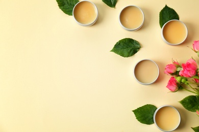 Flat lay composition with hygienic lip balms on color background