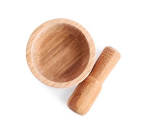 Wooden mortar and pestle on white background, top view