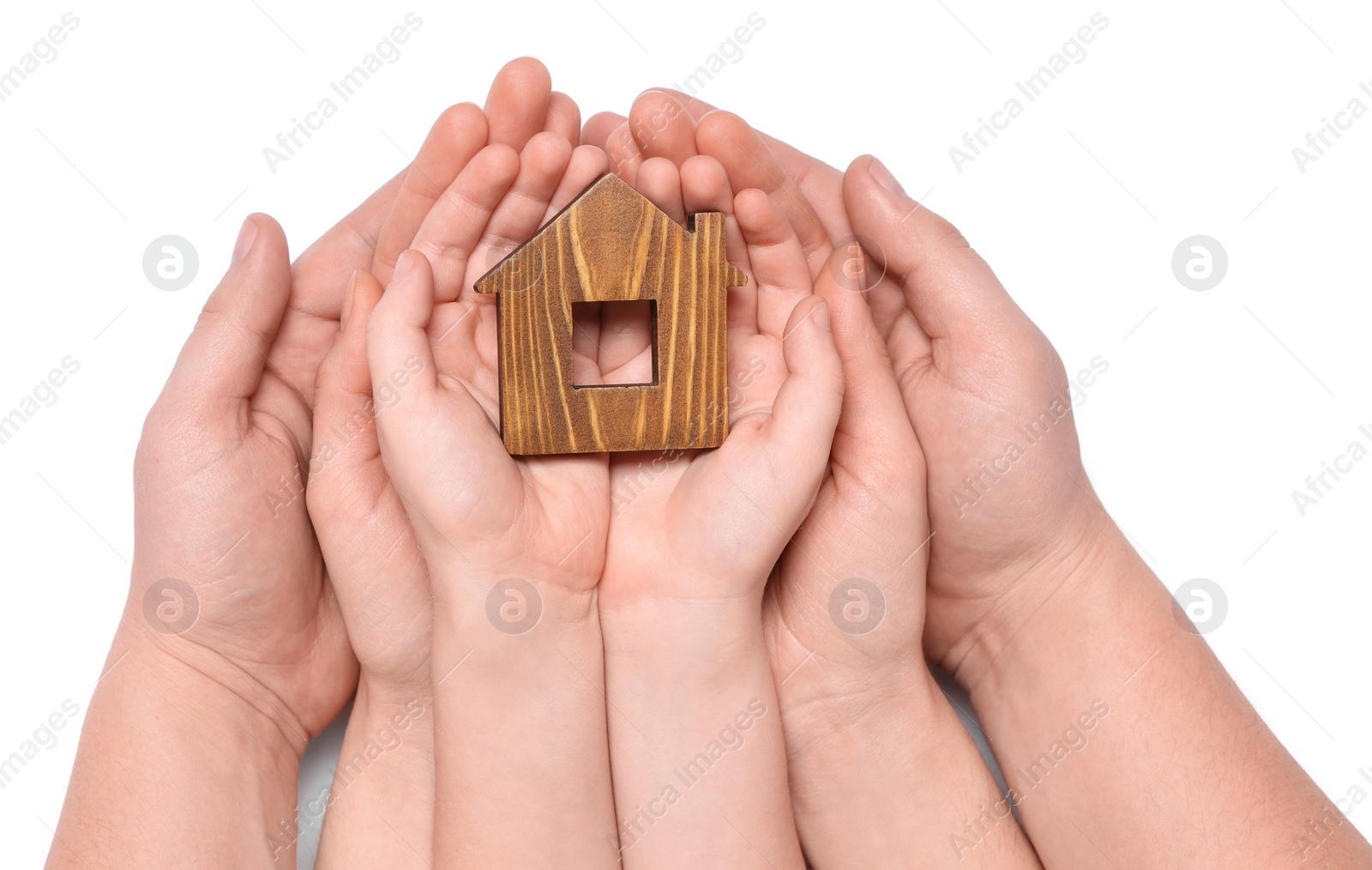 Photo of Home security concept. Family holding house model on white background, top view