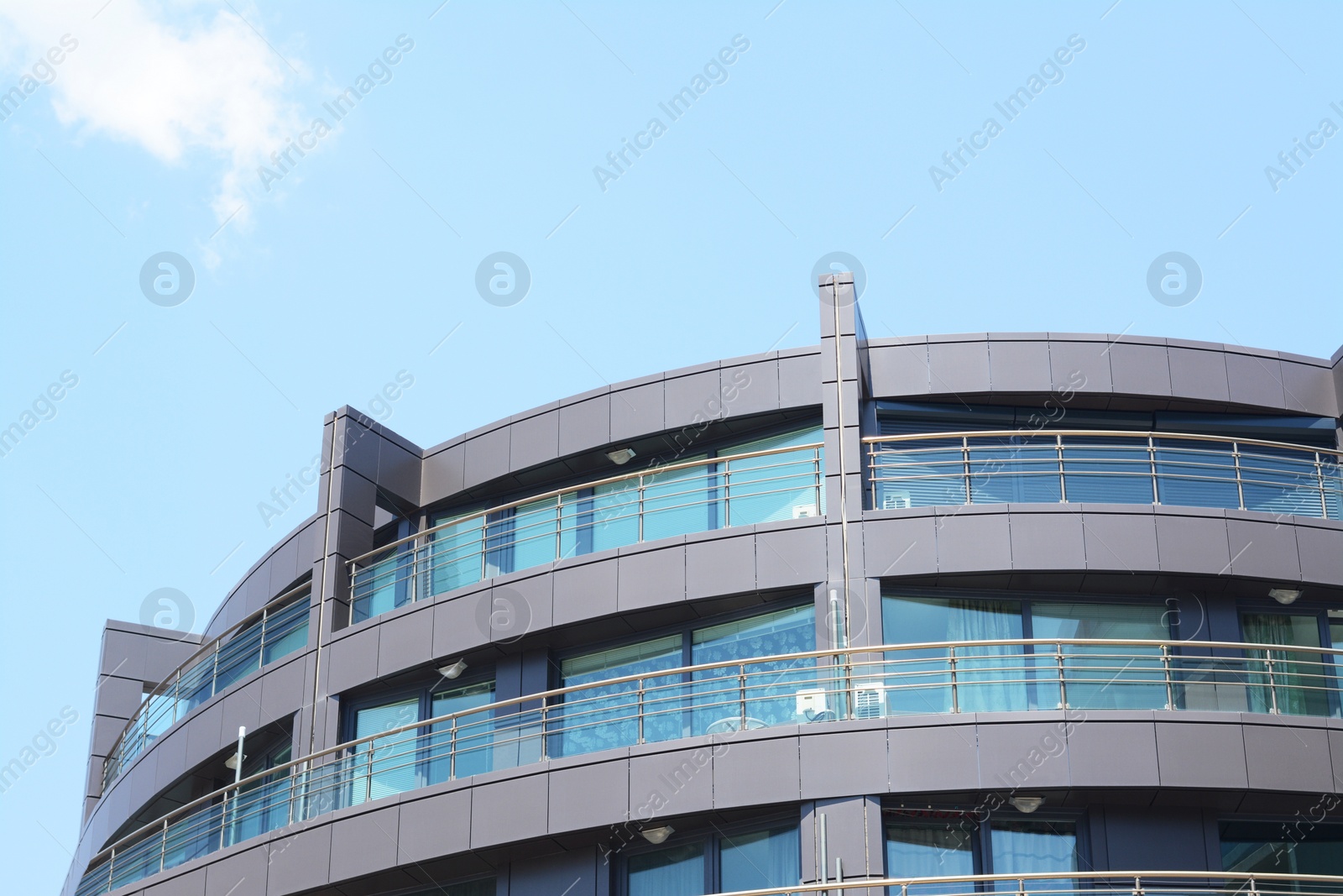 Photo of Exterior of beautiful residential building with balconies, low angle view