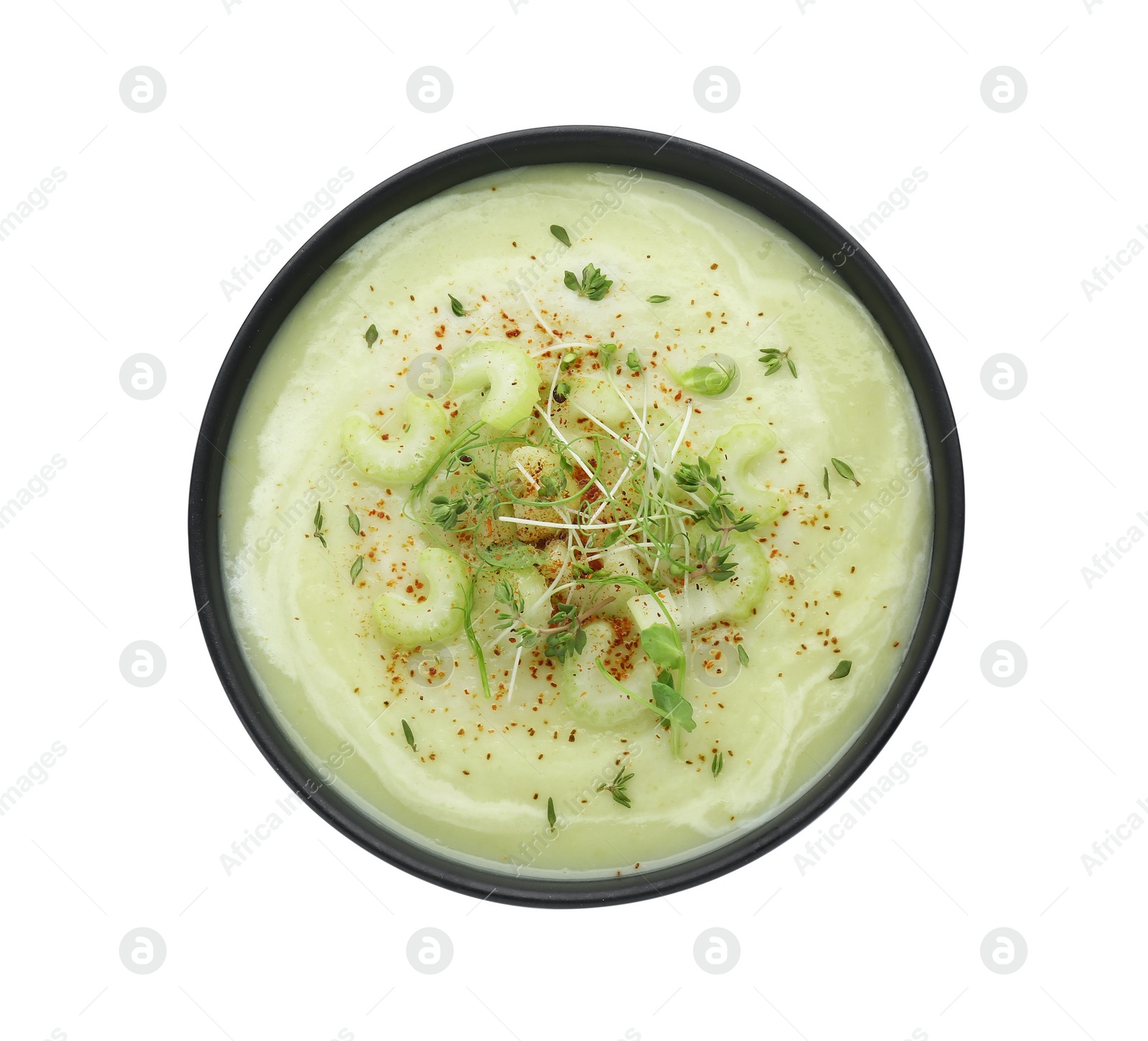 Photo of Bowl of delicious celery soup isolated on white, top view