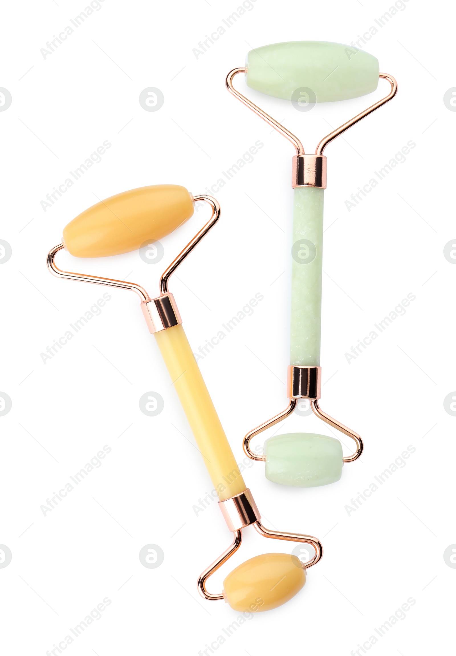 Photo of Different natural face rollers on white background, top view