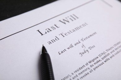 Pen on last will and testament, closeup