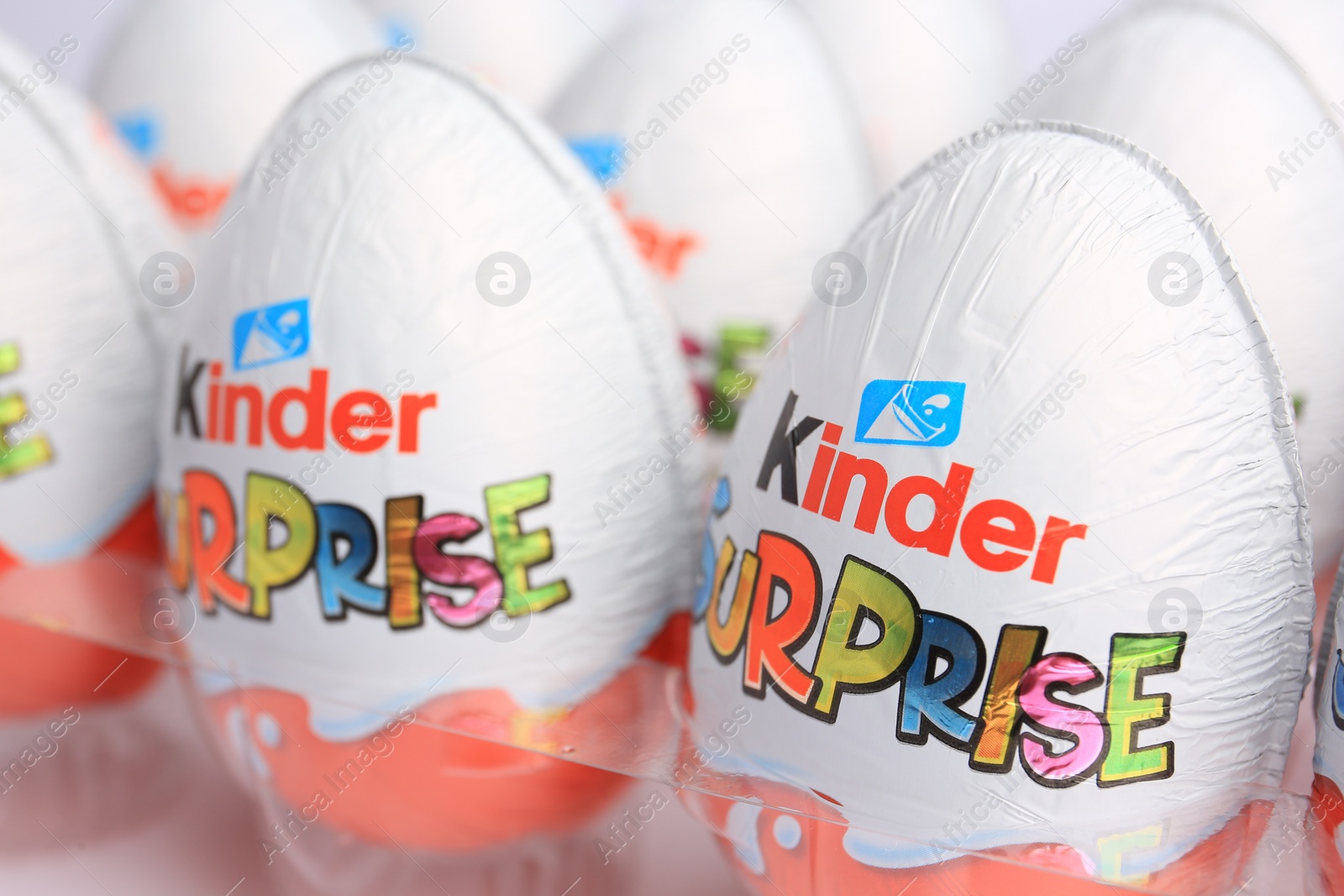 Photo of Sveti Vlas, Bulgaria - June 26, 2023: Kinder Surprise Eggs in plastic tray on white background, closeup