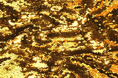 Many beautiful golden sequins as background, closeup