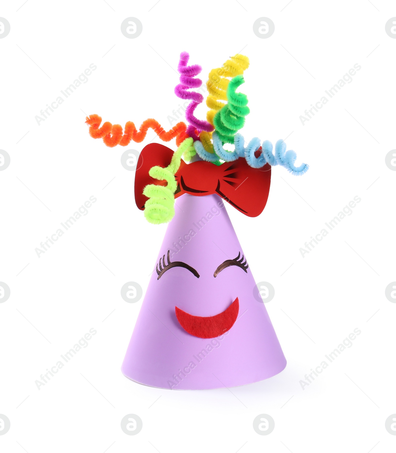 Photo of Bright party hat with funny face isolated on white. Handmade decoration