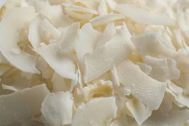 Photo of Delicious fresh coconut chips as background, closeup