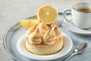 Photo of Delicious lemon meringue pie on tray, closeup