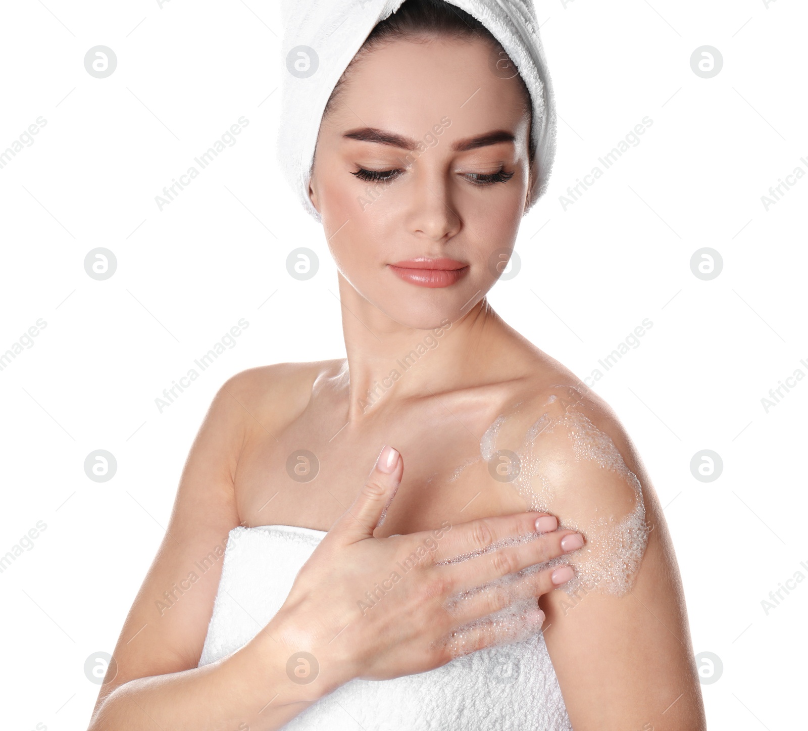 Photo of Young woman washing body with soap on white background