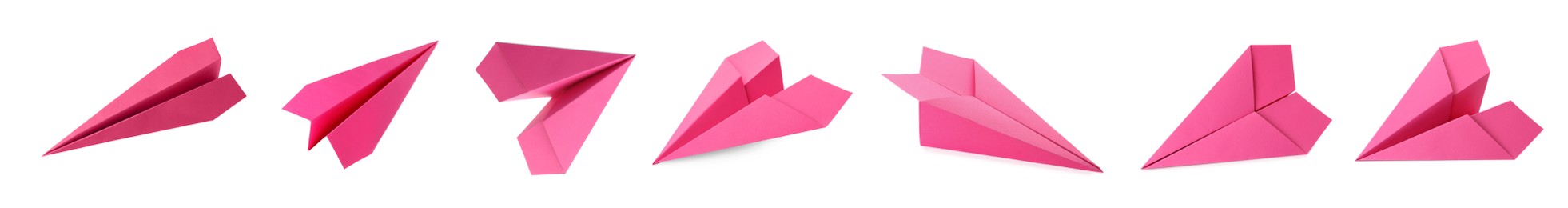 Image of Set with handmade pink paper planes on white background